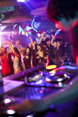 DJ doing record Scratching in nightclub