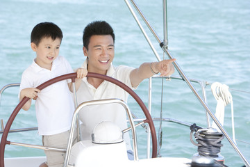 Father and son sailing