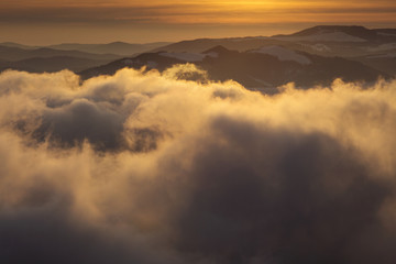 Fototapeta na wymiar Winter sunset over the clouds - Panoramic view