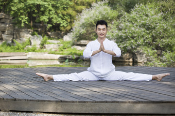 Fototapeta premium Young man practicing yoga
