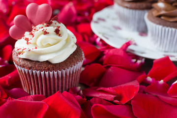 Valentine cupcake and red petals
