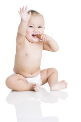 Cute baby boy eating biscuit