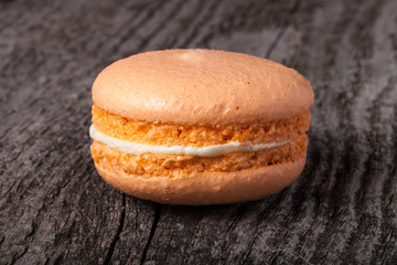 Macaroons on a old grey wooden background. Selective focus