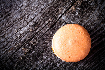 Macaroons on a old grey wooden background. Toned