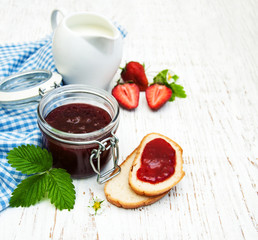 Strawberry jam and fresh strawberries