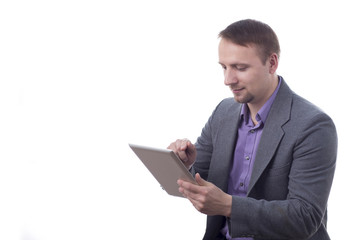 Man in suit holding tablet