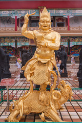 Fototapeta premium Buddhist golden statue.