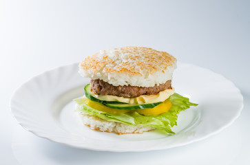 Japanese food, grilled meat in Rice burger, served on plate (sha