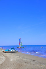 A small sailing yacht.