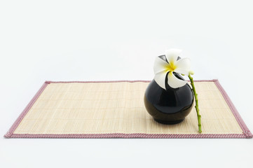 Hanging bamboo basket of flower.