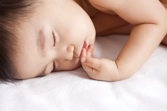 Adorable baby boy in sweet dream