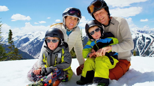 portrait snow outdoor lifestyle Caucasian family sons sport travel promotion 