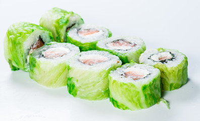 close-up of  Japan sushi roll with salmon and green lettuce (sha