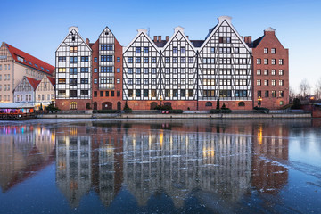 Fototapeta na wymiar Architecture of the old town in Gdansk with frozen Motlawa river, Poland