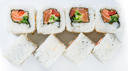 close-up of  Japan sushi white rice, salmon and cucumber (shallo