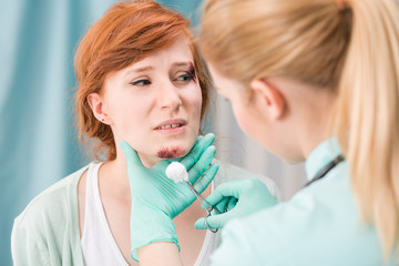 Woman with chin injury