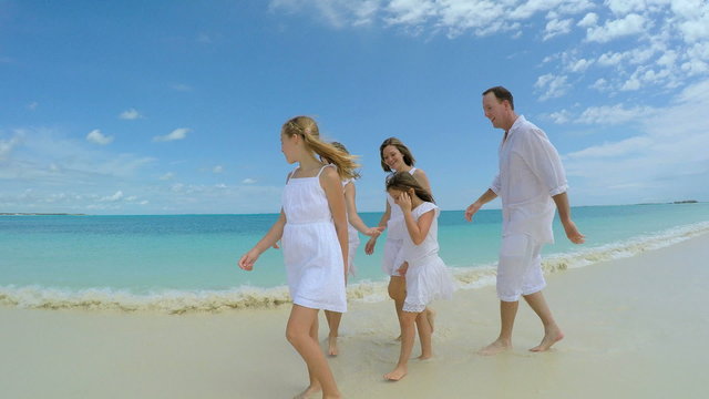 Caucasian family enjoying tropical vacation beach 