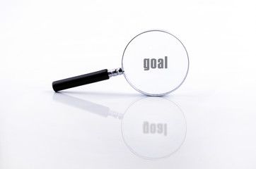 Magnifying glass in a metal frame with rubber black handle