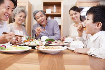 Obraz na płótnie Canvas Happy family enjoying meal time