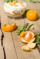 peeled tangerine with a sprig of mint