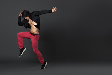 Fototapeta na wymiar Young male professional dancer dancing in studio.