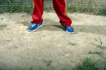 Fototapeta premium Low Section Shot Of Teenage Boy Wearing Casual Clothing