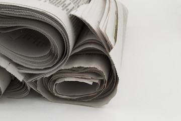 Heap rolls of newspapers
