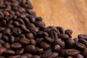 Coffee beans on the wooden floor