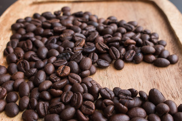 Coffee beans on the wooden floor