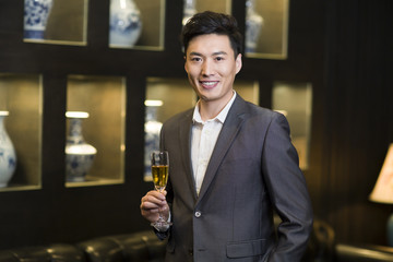 Young businessman with champagne