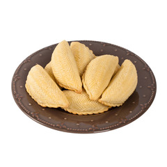 Ramadan Sweet Pastry called Shekerbura from Azerbaijan on white background. Selective focus.