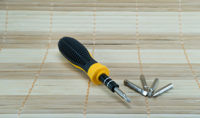 screw driver on bamboo matting - 99541906