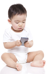 Adorable baby boy with smart phone