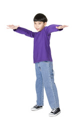 Young smiling boy holding arm up