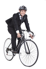 Obraz premium Joyful young businessman riding a bike
