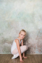 Little girl dancer doing stretching before exercise, dance, sports, healthy lifestyle