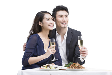 Happy young couple having dinner
