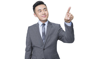Young businessman using finger to point