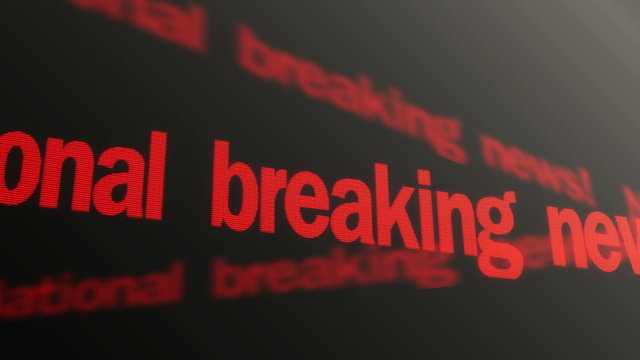 National breaking news red text running on television. Exclusive interview on TV