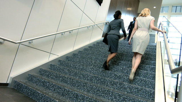 Male female multi ethnic financial business team on office atrium