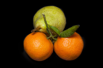 two tangerines and a pear