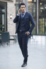 Confident businessman talking on the phone