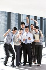 Businesspeople cheering over good news