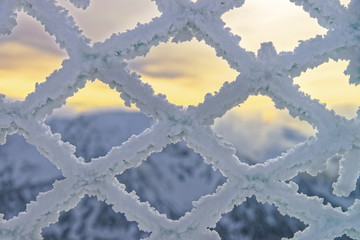 Fencing mesh being frozen in mountains