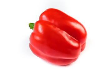 Single red bell pepper isolated on white