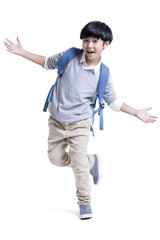 Cheerful boy with schoolbag on back