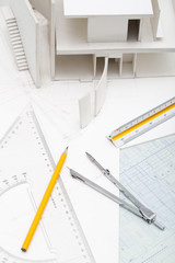 Office stationery and building model in design studio