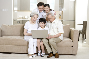 Multi generation family using a laptop