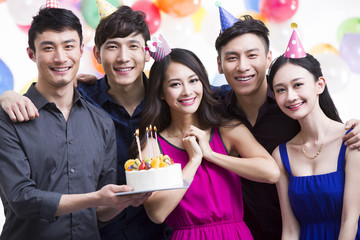 Young adults having a birthday party