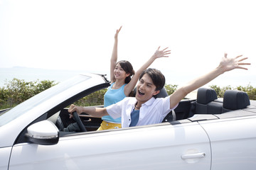 Young People Having Fun in a Convertible